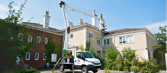 Gutter cleaning a commercial property in Leigh